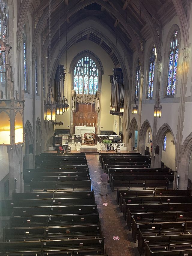 View nave with pipe organ console in the distance.